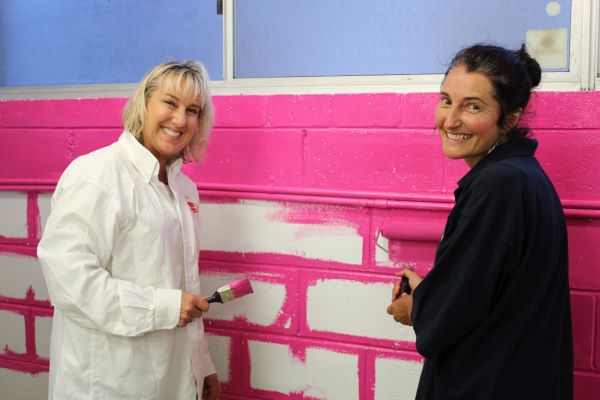 Julie Gray gets painting with CEO Kate Melhopt. 
